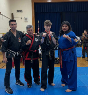 Martial arts students in uniform at Johnny Karate NYC, demonstrating discipline and skills in a comm.
