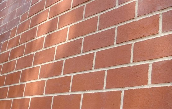 Close-up of historic brick masonry with tuckpointing work.