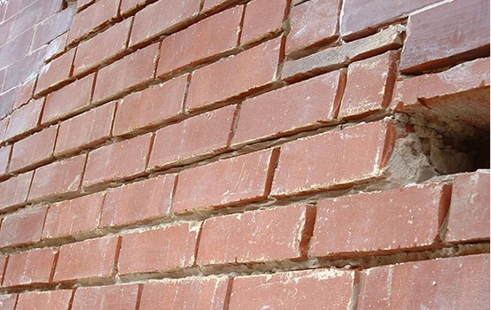 Close-up of historic brick masonry with tuckpointing work.