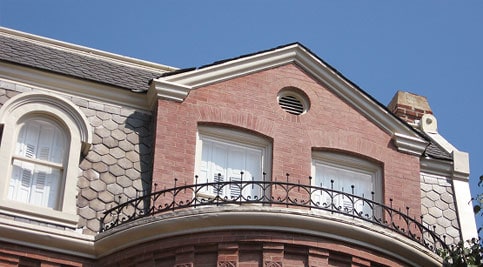 Historic masonry and tuckpointing on a Renaissance-style building facade.