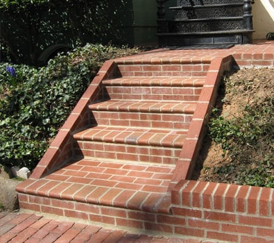 Brick staircase with detailed masonry work and red brick finish.