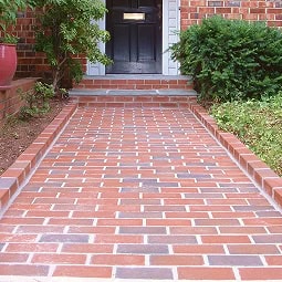 Beautiful brick walkway with detailed masonry work and clean tuckpointing.
