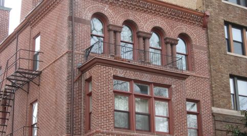 Historic masonry and tuckpointing on a classic brick building facade.