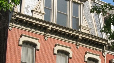 Historic brick building with detailed masonry and tuckpointing work.