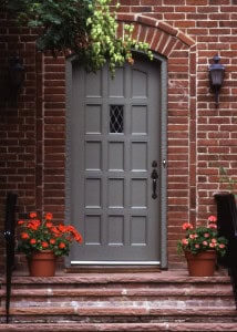 Beautiful brick masonry door with tuckpointing detail and decorative window.