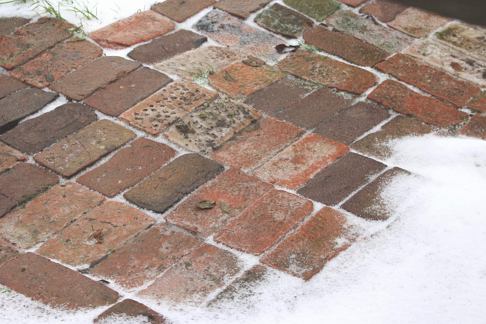 Close-up of historic brick masonry with tuckpointing and weathered mortar joints.