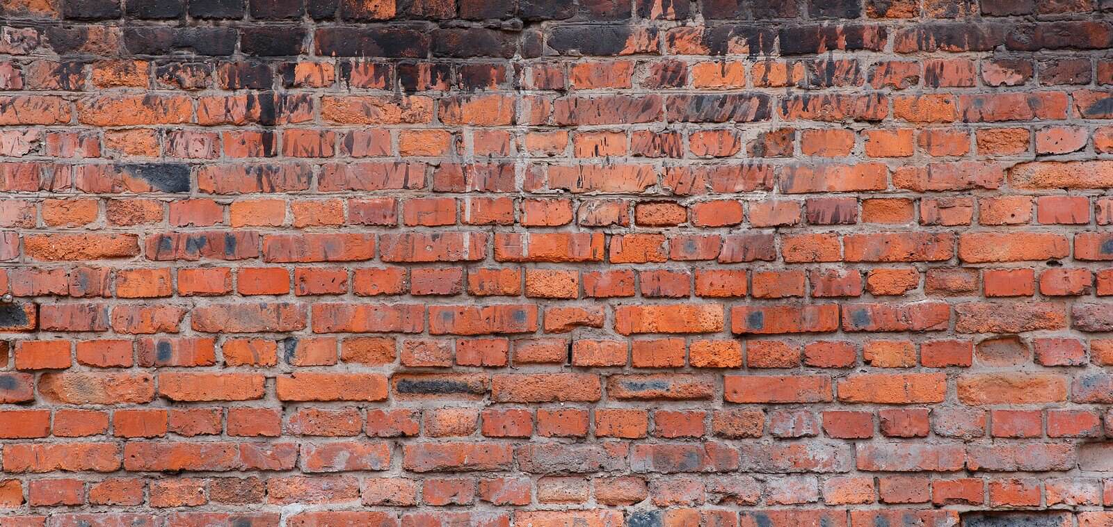 Close-up of historic brick masonry with tuckpointing work.