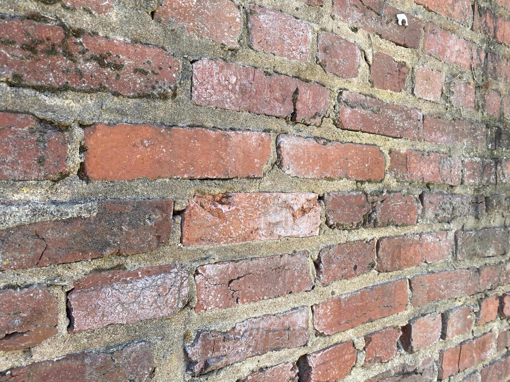 Close-up of historic brick masonry with detailed tuckpointing work.