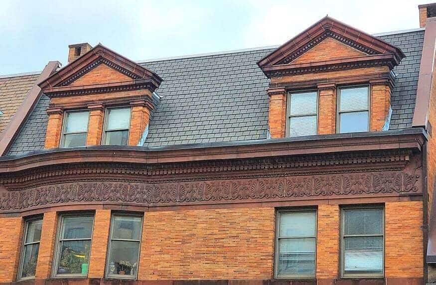 Historic masonry and tuckpointing work on a classic brick building facade.