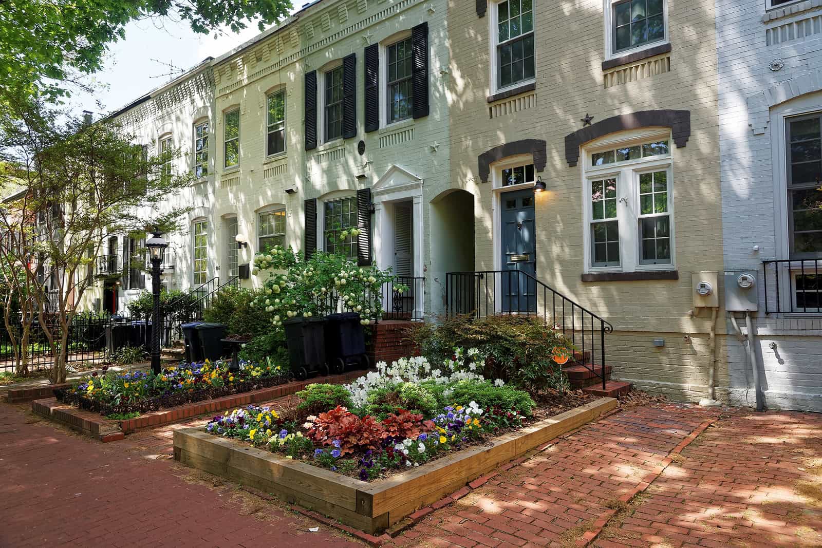 Historic brick row houses with well-maintained facades and decorative masonry details.