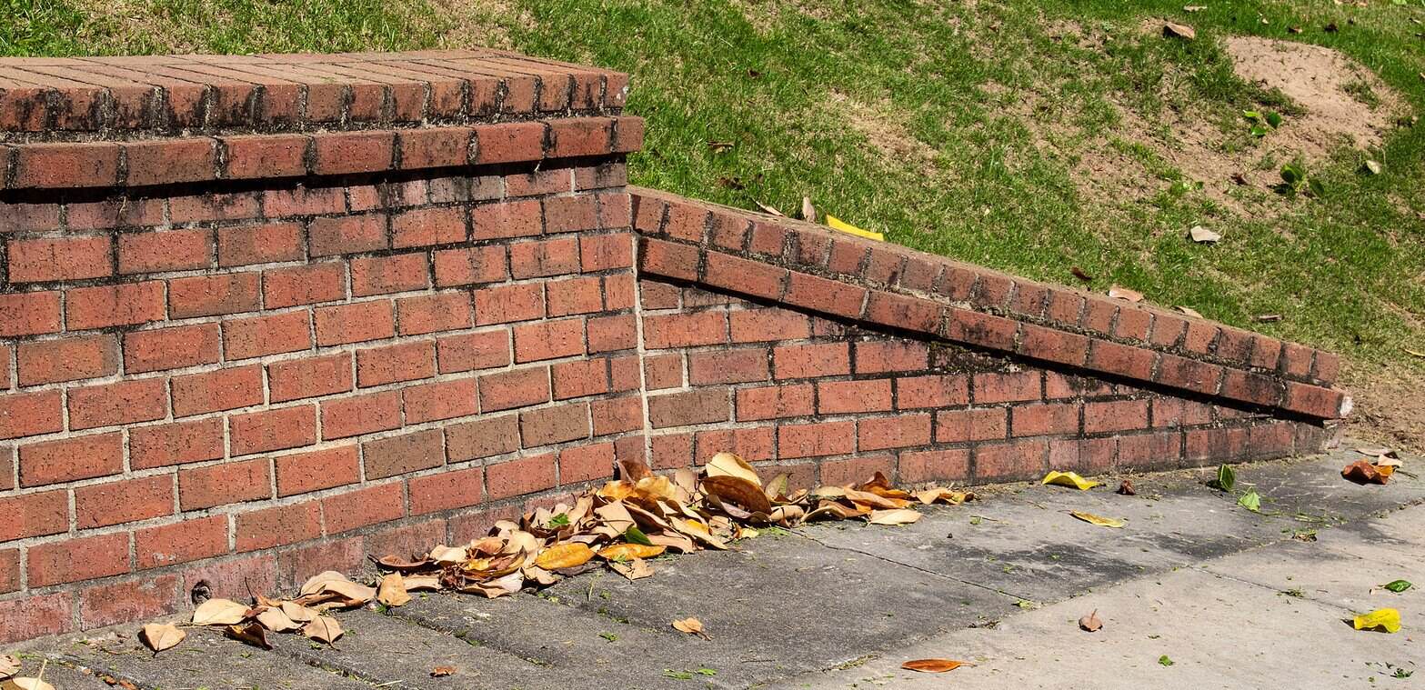 Close-up of historic brick masonry and tuckpointing work on a building wall.