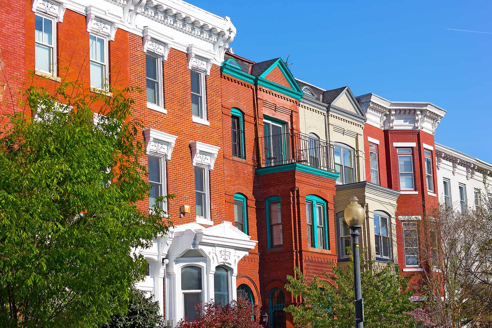 Beautiful historic row houses with detailed masonry and tuckpointing work in a city neighborhood.