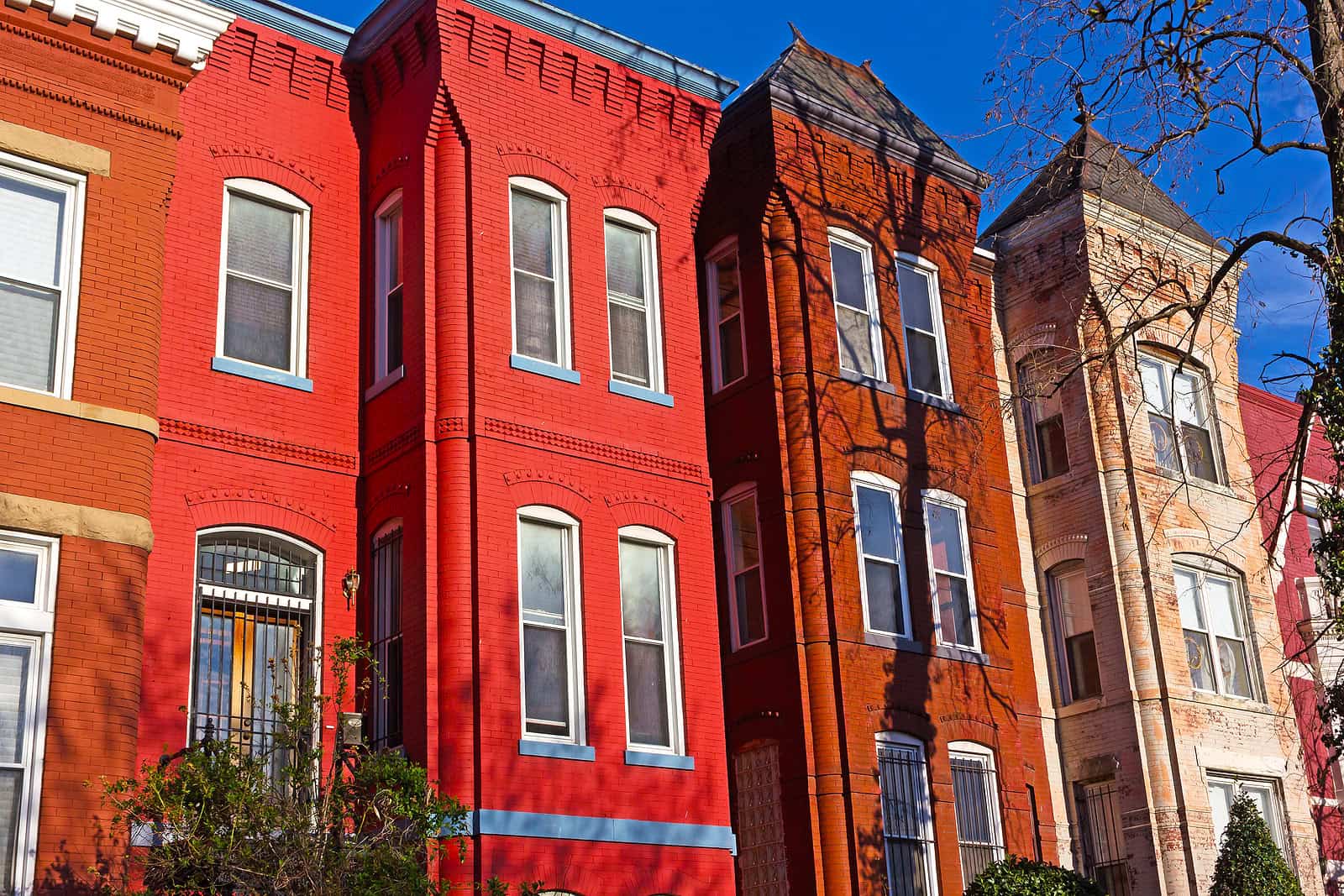 Historic brick row houses with detailed masonry and tuckpointing work.