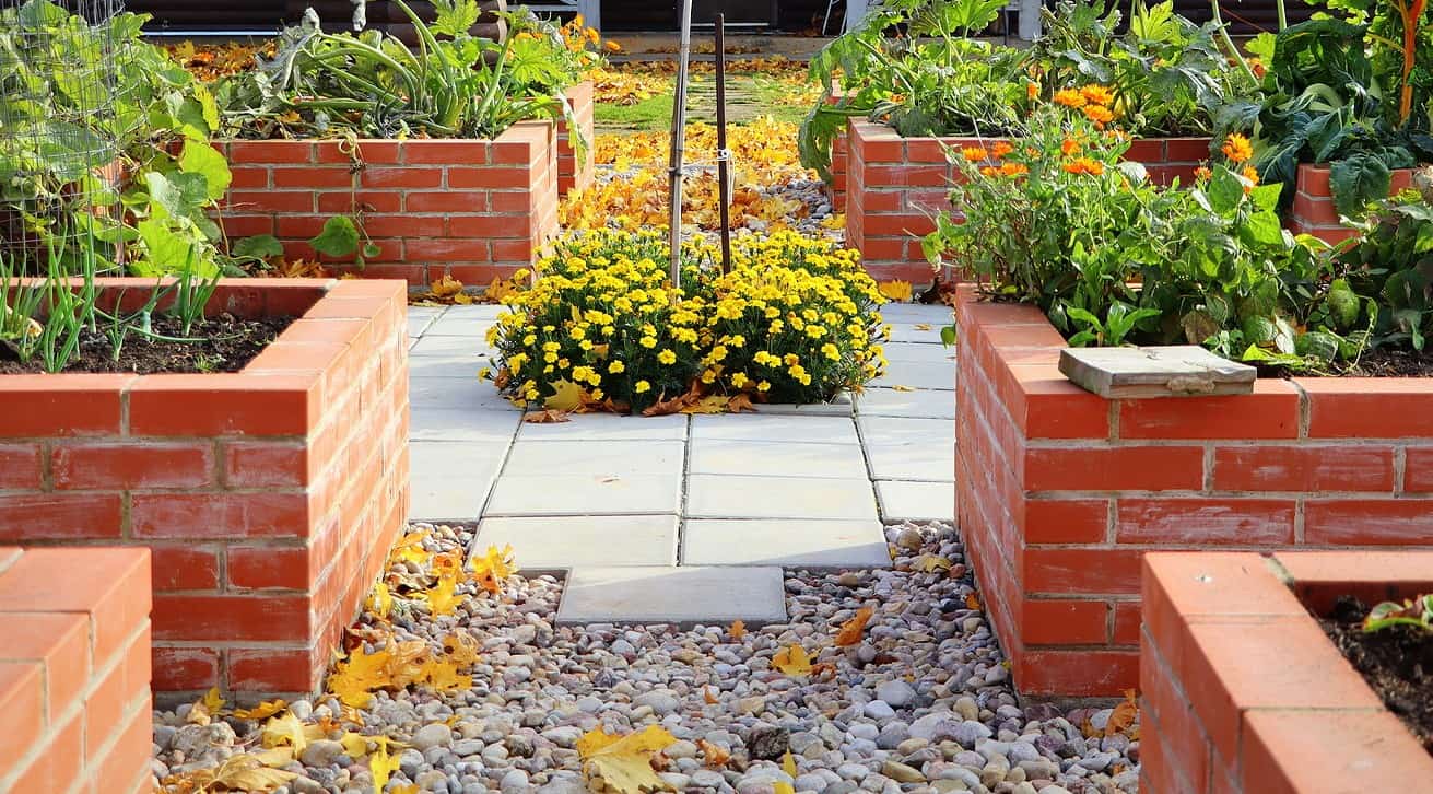 Renaissance Masonry and Tuckpointing work on historic brick garden walls.