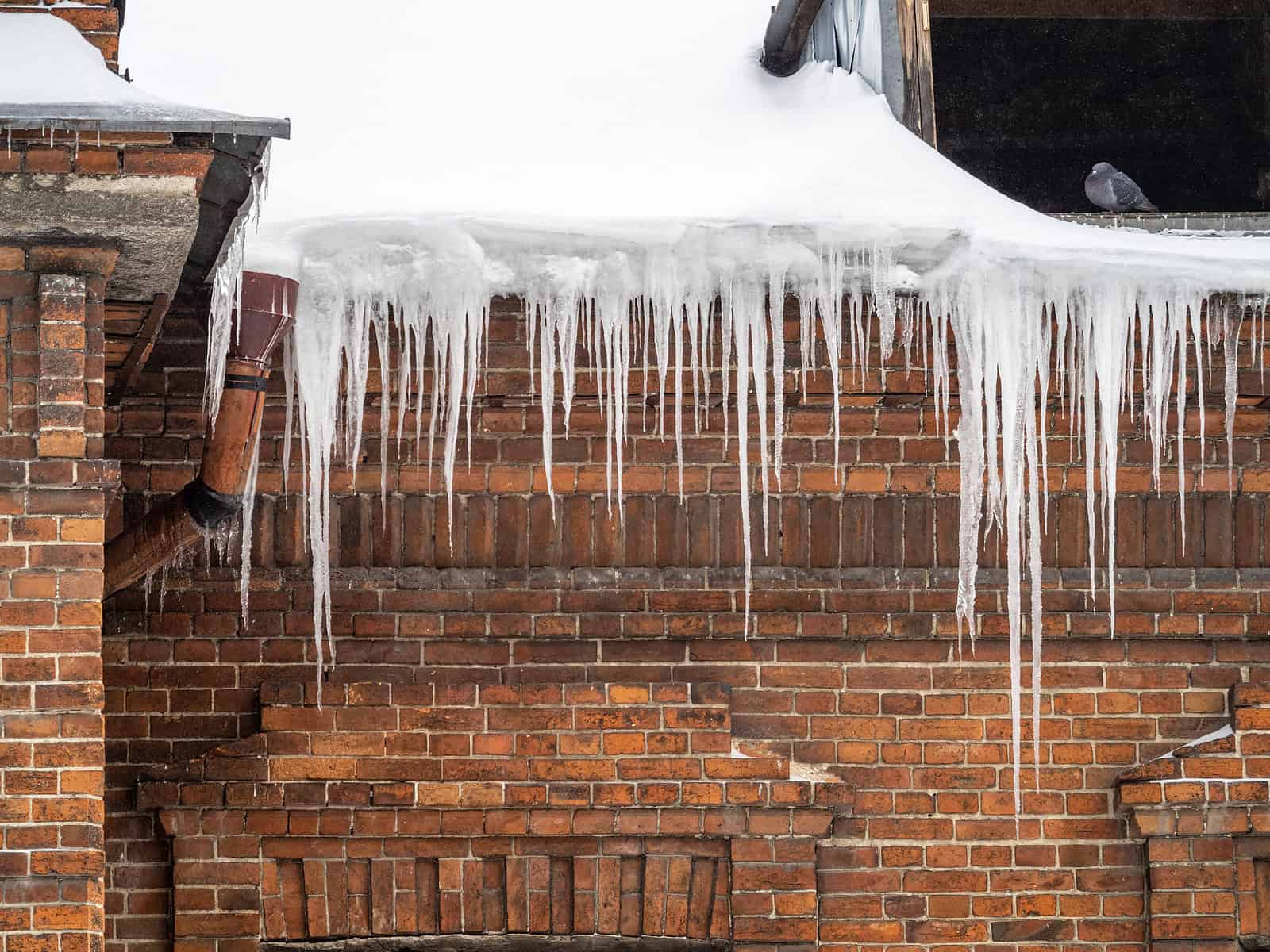 Ice and Snow on Historic Brick Masonry with Tuckpointing.
