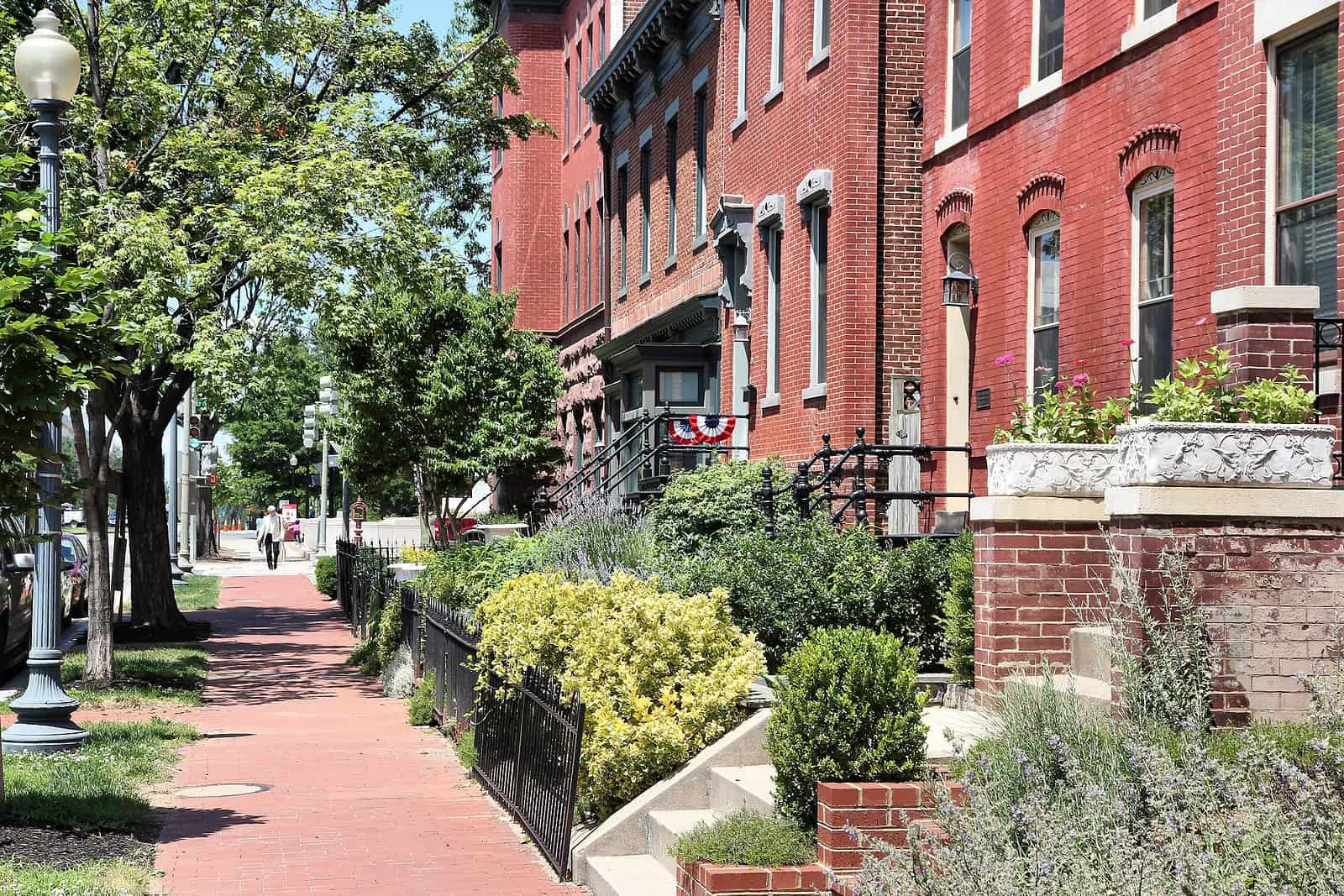 Historic brick building with detailed masonry and well-maintained landscaping.