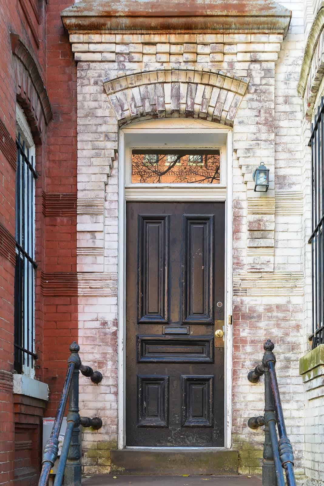Historic masonry and tuckpointing work on a classic brick building entrance.