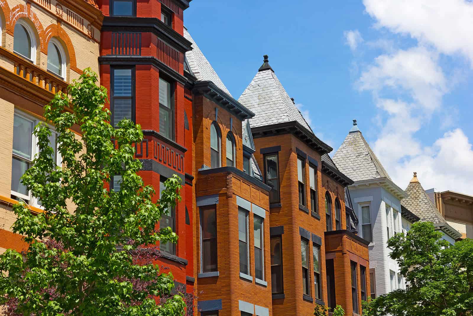 Historic masonry and tuckpointing on colorful Renaissance-style buildings.