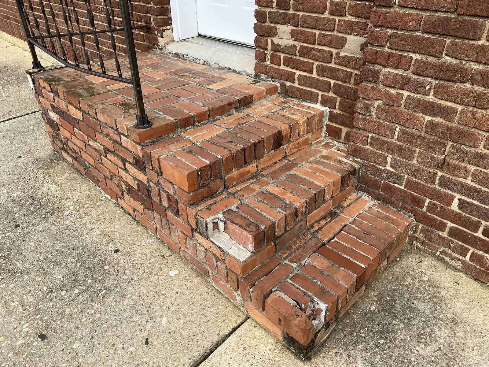 Historic brick steps and masonry restoration at Renaissance Development site.