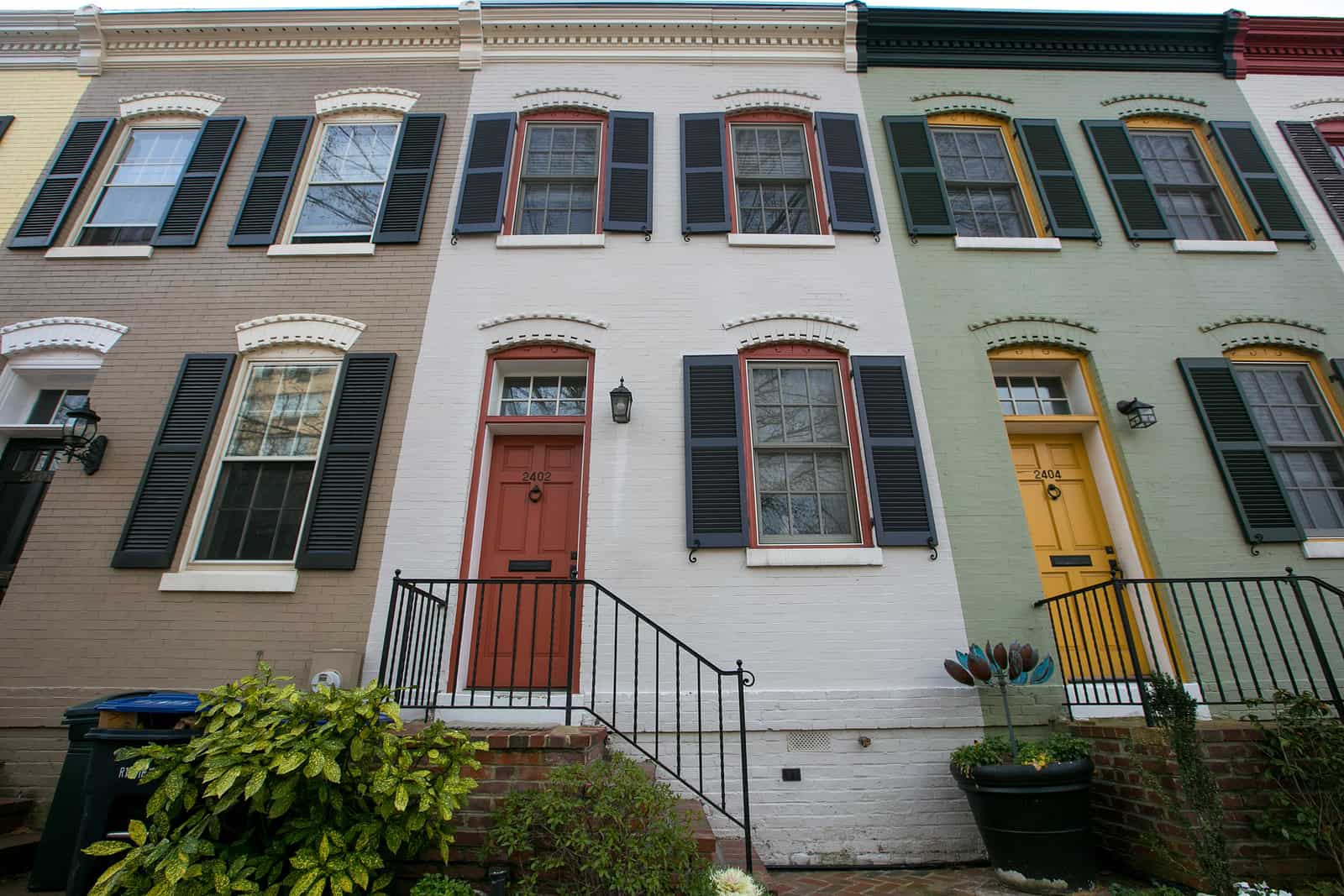 Historic row houses with colorful facades and detailed masonry work.