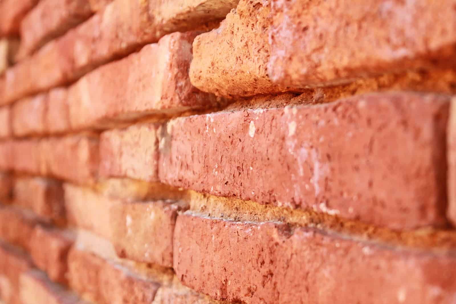 Close-up of historic brick masonry with detailed tuckpointing work.