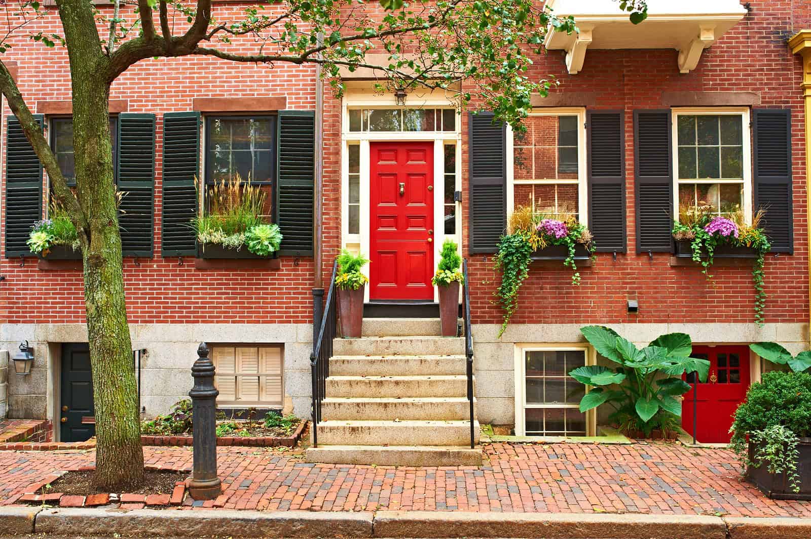 Restoration of historic brick masonry with precise tuckpointing and masonry work on a classic red br.