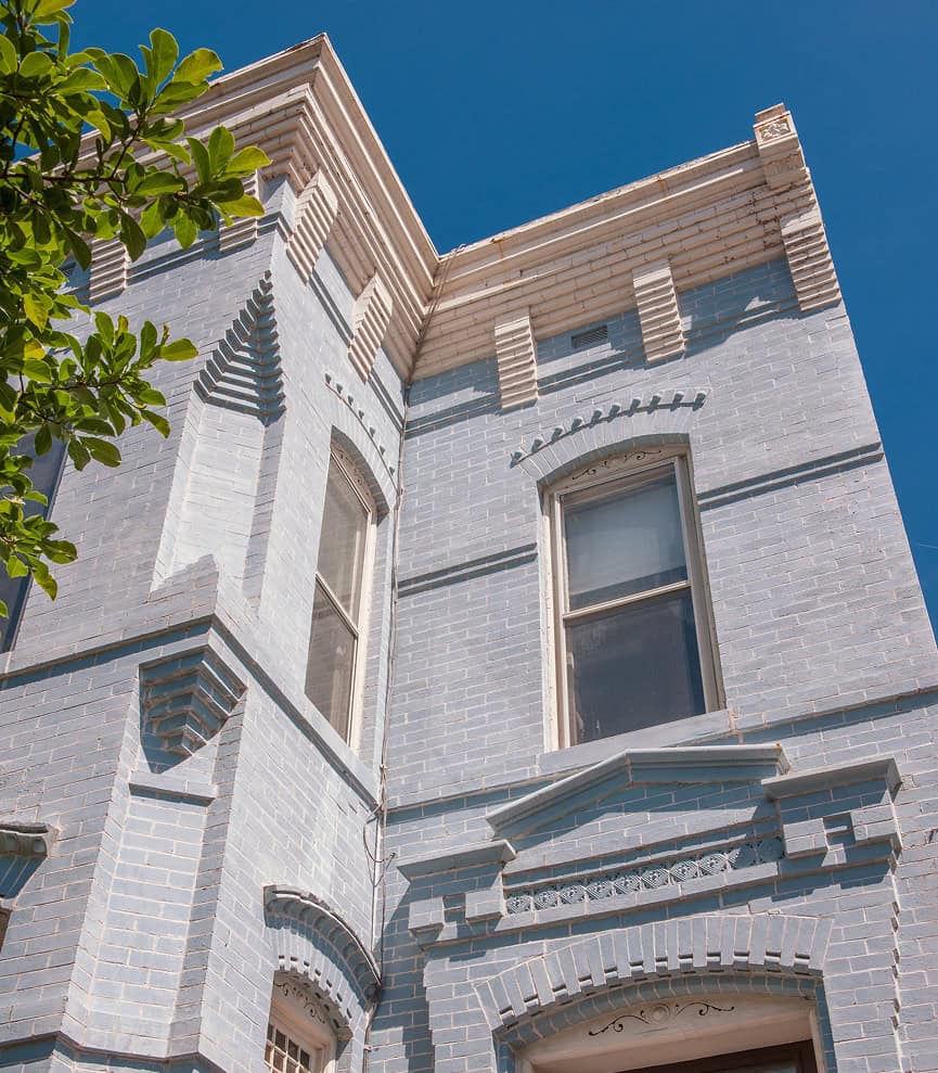 Historic brick building with detailed masonry and decorative architectural features.