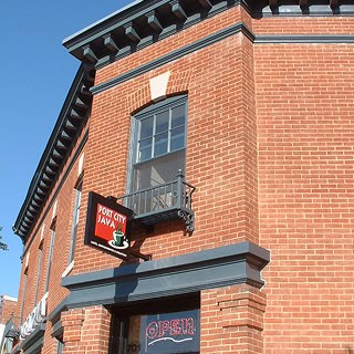 Close-up of historic brick masonry with detailed tuckpointing on a restored building facade.