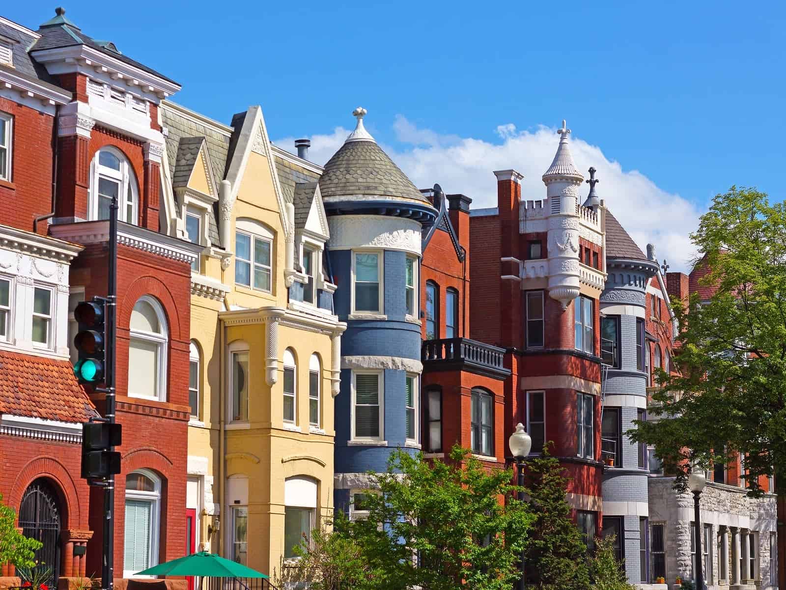 Historic row houses with colorful facades and ornate masonry details.