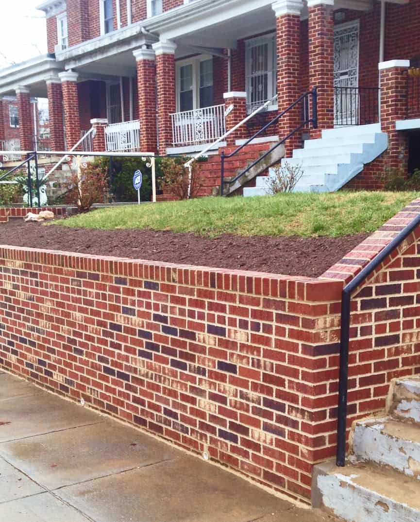 Brick wall with new tuckpointing and masonry work in a historic neighborhood.