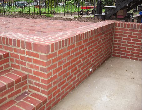 Close-up of historic brick masonry and tuckpointing work on a building.