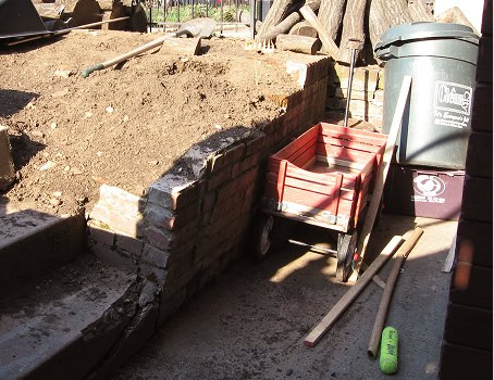 Historic masonry work with brick wall repair and tuckpointing process.