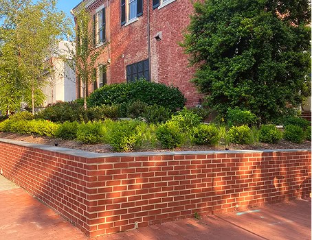 Historic brick masonry and tuckpointing work on a building exterior.