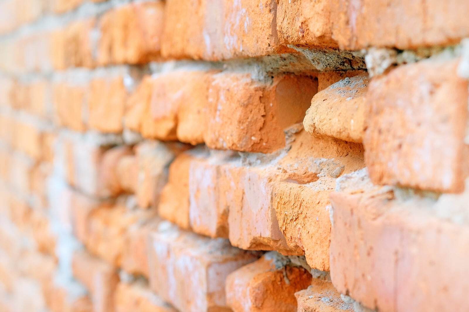 Close-up of historic brick masonry with detailed tuckpointing work.
