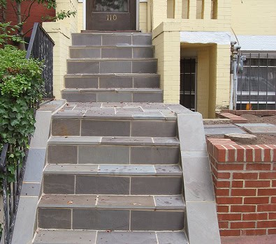 Restoration of historic masonry and tuckpointing on a residential building. Skilled craftsmanship in.