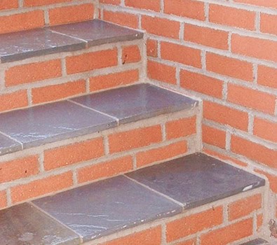 Beautiful brick and stone masonry with detailed tuckpointing work.