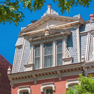 Restoration of historic brick masonry with detailed tuckpointing on a classic building.