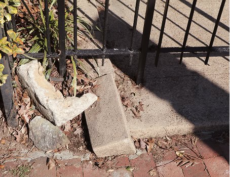 Close-up of historic masonry and tuckpointing work on a building's foundation.