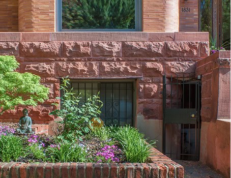 Historic masonry and tuckpointing work on a brick building facade.