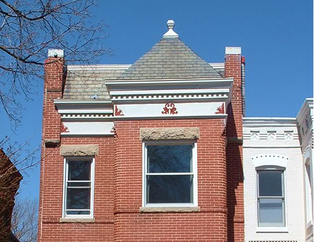 Historic brick building with detailed masonry restoration and tuckpointing work.