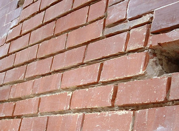 Close-up of historic brick masonry with tuckpointing work.